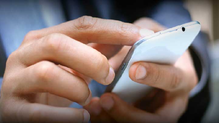 Person On Touchscreen Phone