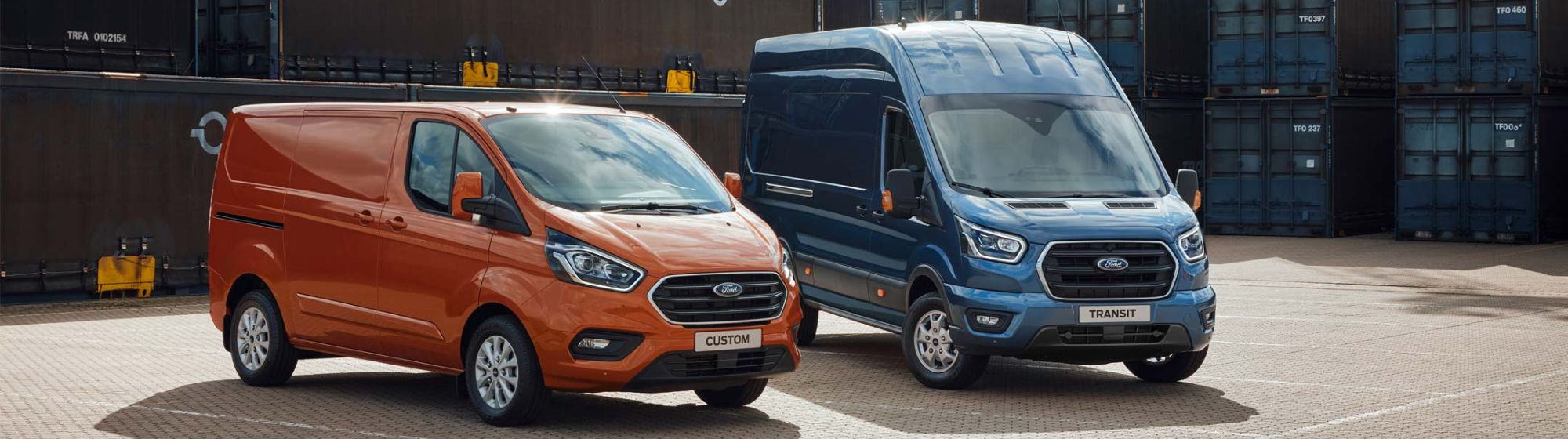 1 orange and 1 blue ford van