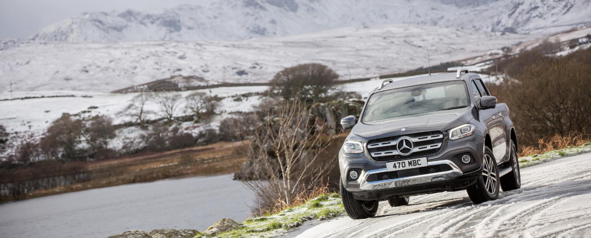 Mercedes-Benz SUV Driving in Snow