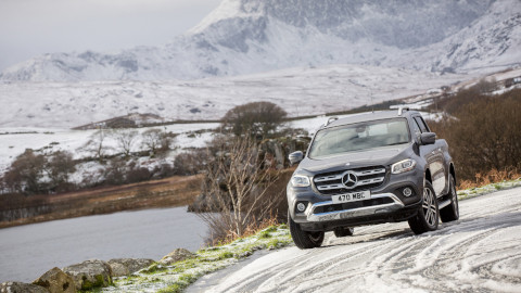 Mercedes-Benz SUV Driving in Snow