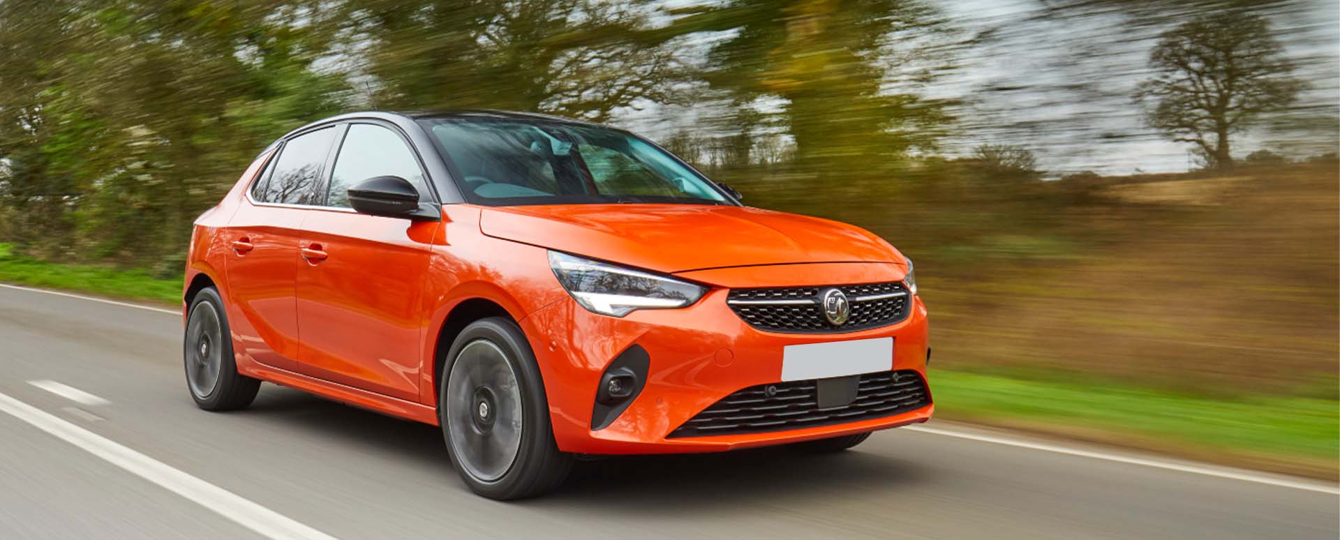 Orange Vauxhall Corsa Electric Driving