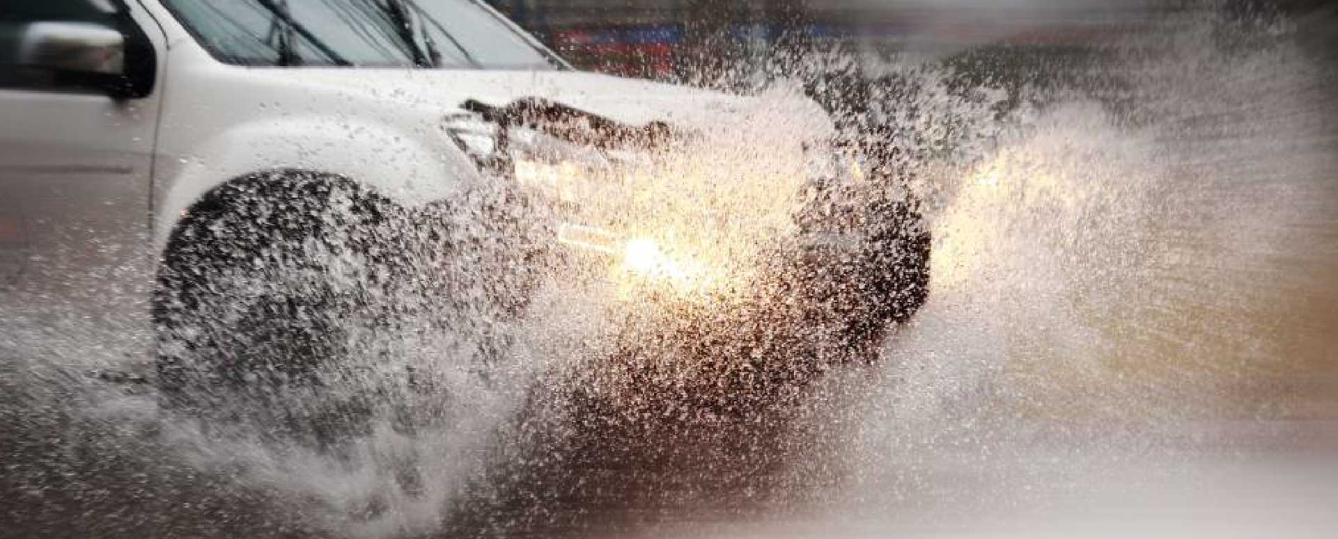 Car Driving Through Floodwater