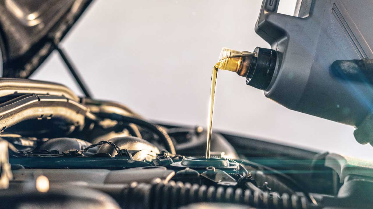 Oil Being Put Into Car