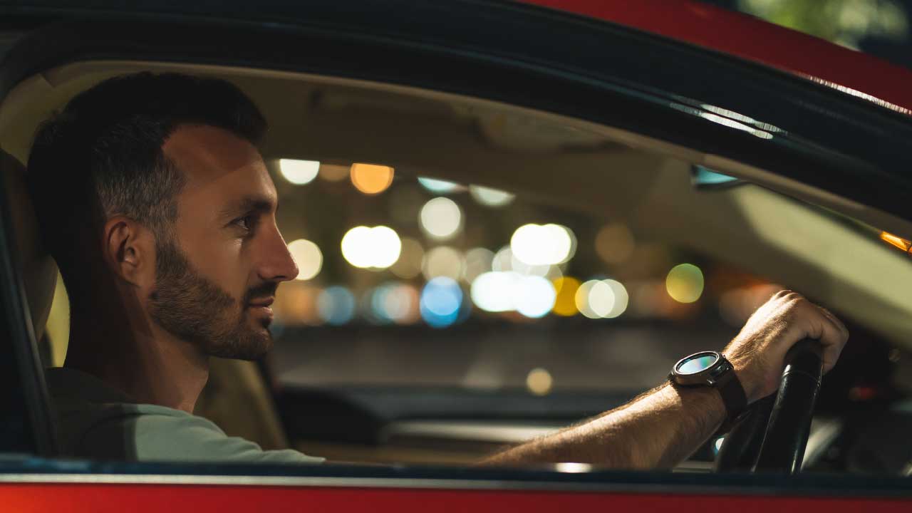Man Driving In Car At Night