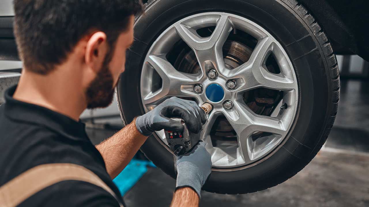 Man Servicing Cars Tyres