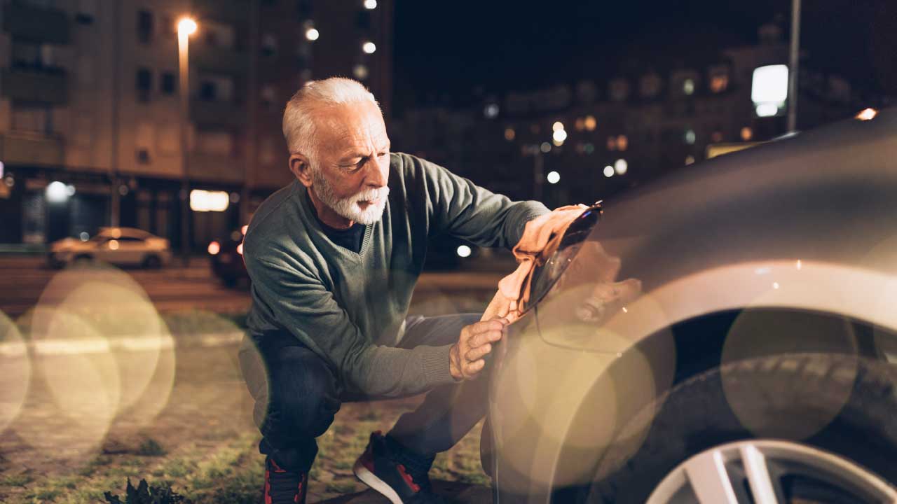 Man Checking Cars Headlights