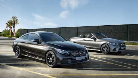 Pair of Mercedes-Benz cars driving, studio shot