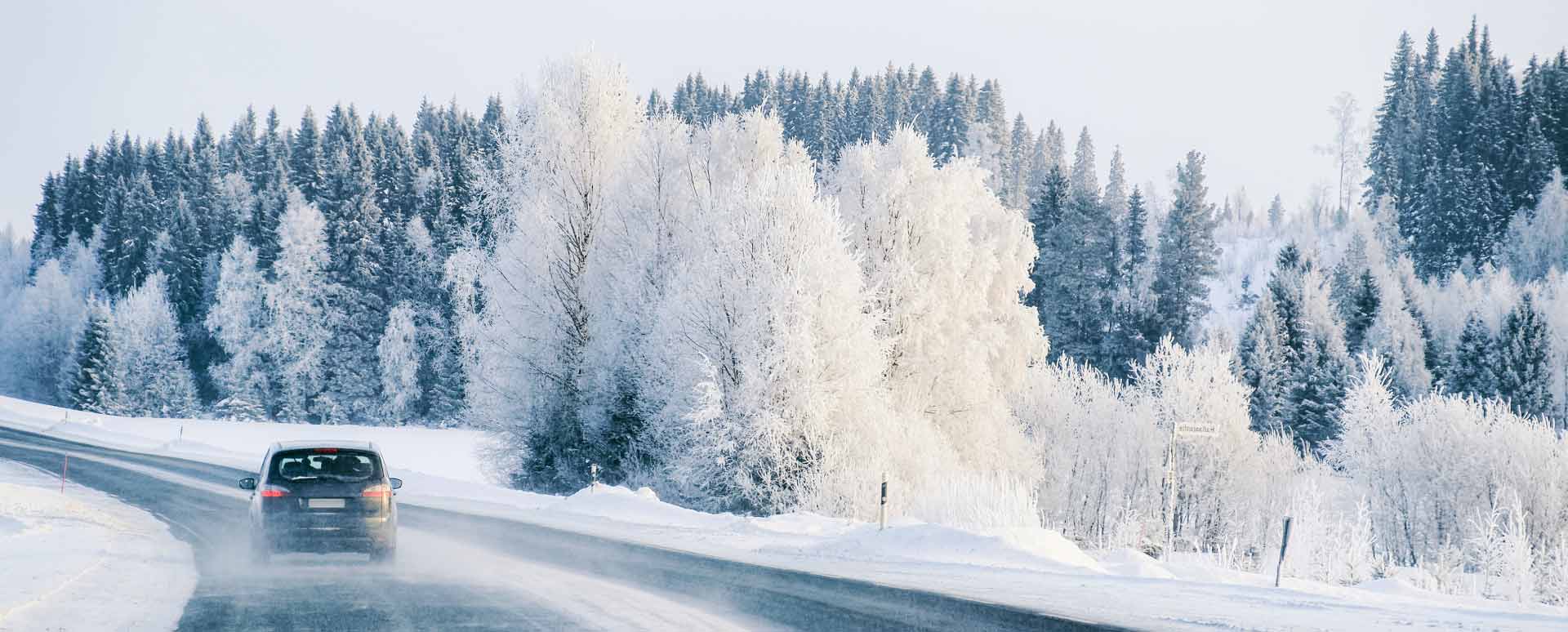 Car Driving In Snowy Weather Conditions