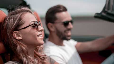 Man And Woman Driving In Car