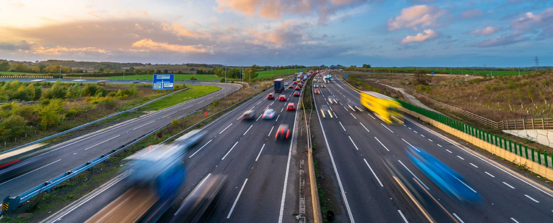 Speeding Vehicles On Motorway Blurred Lights