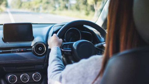 Woman Driving In Car