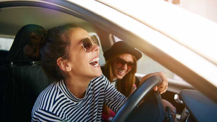 Two People Laughing in Car