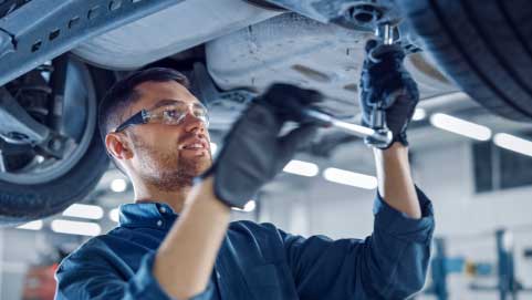 Service Technician Working on Car